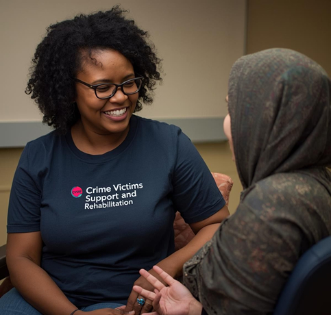 woman speaking to a victim